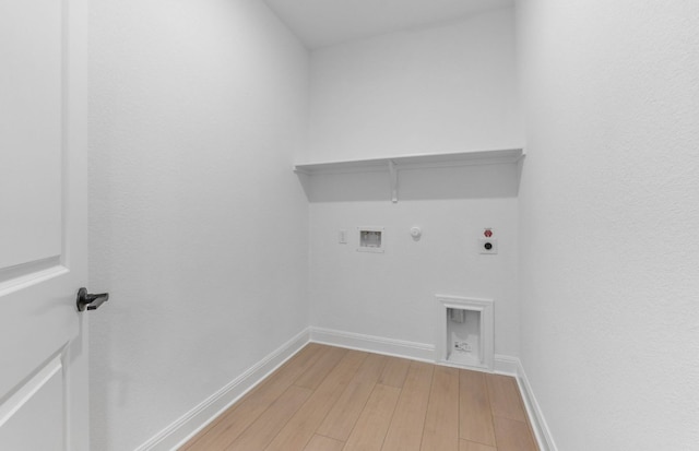 laundry room with hookup for a gas dryer, hookup for an electric dryer, light wood finished floors, hookup for a washing machine, and baseboards