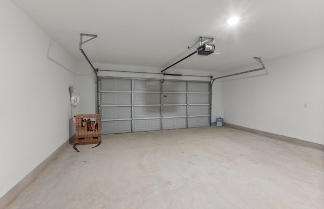 6517 Apache Plum Ln, Spicewood, TX 78669 - garage featuring a garage door opener and baseboards
