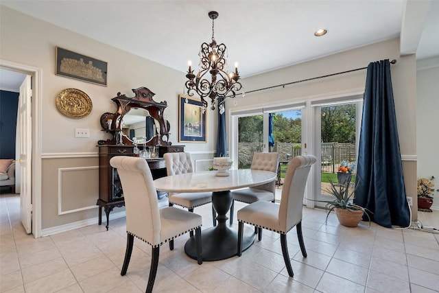 1101 Lakeway Dr Unit D, Lakeway, TX 78734 - dining room with a chandelier, light tile patterned floors, and wainscoting