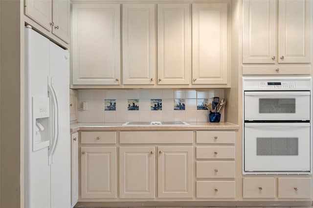 1101 Lakeway Dr Unit D, Lakeway, TX 78734 - kitchen featuring white appliances, light countertops, tasteful backsplash, and white cabinetry