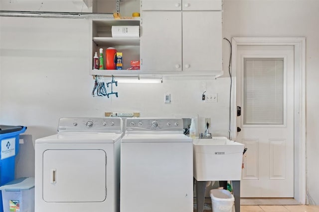 1101 Lakeway Dr Unit D, Lakeway, TX 78734 - laundry room with cabinet space, washer and dryer, and light tile patterned flooring
