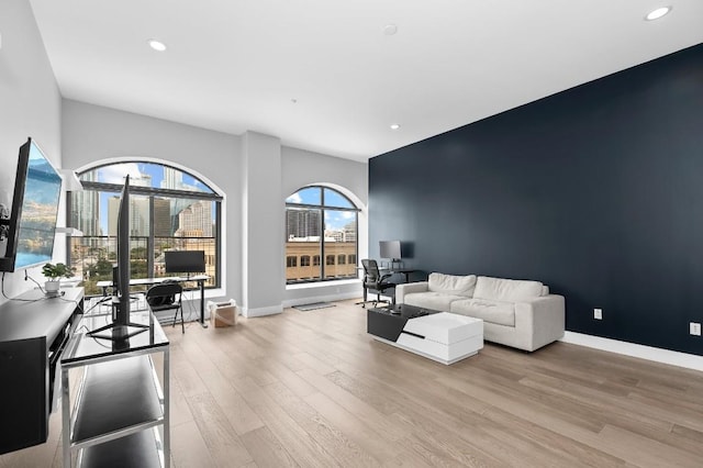 507 Sabine St Unit 505, Austin, TX 78701 - living area featuring light wood-style flooring, an office area, and recessed lighting