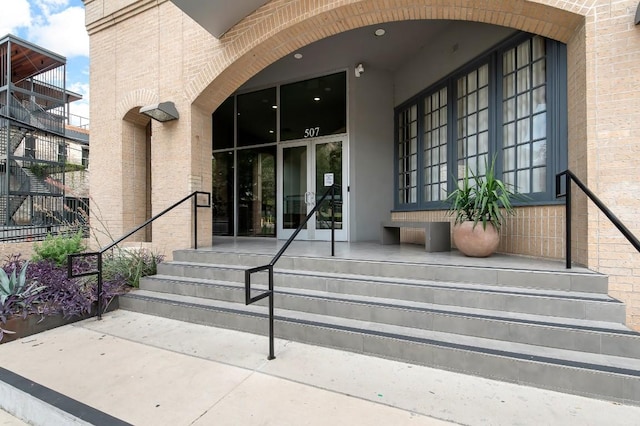 507 Sabine St Unit 505, Austin, TX 78701 - entrance to property with french doors and brick siding