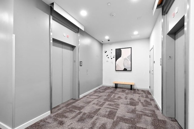 507 Sabine St Unit 505, Austin, TX 78701 - corridor with carpet floors, elevator, and recessed lighting