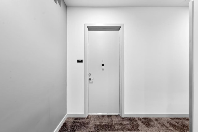 507 Sabine St Unit 505, Austin, TX 78701 - entryway with dark colored carpet and baseboards