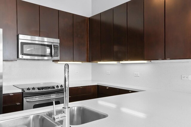 507 Sabine St Unit 505, Austin, TX 78701 - kitchen with appliances with stainless steel finishes, light countertops, and modern cabinets