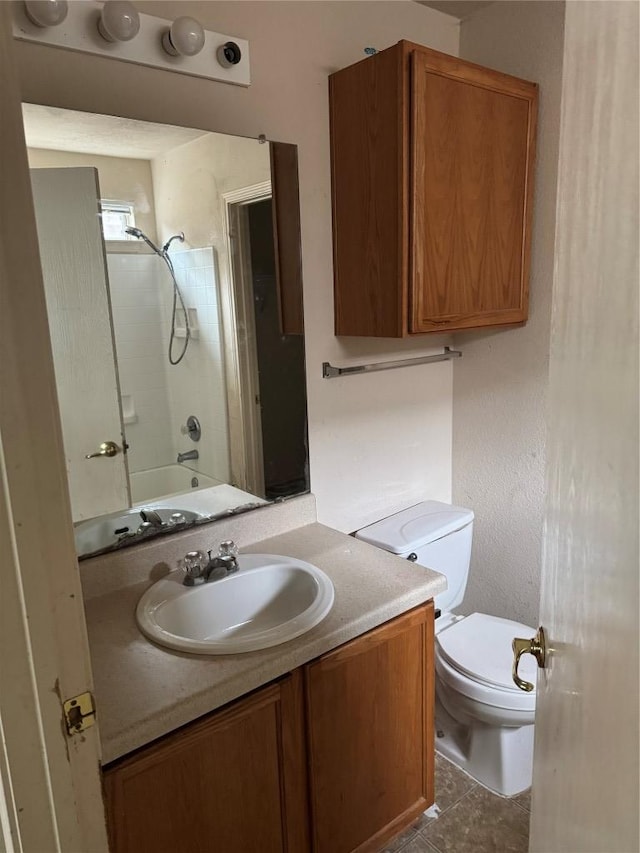 full bathroom with tile patterned flooring, tub / shower combination, toilet, and vanity