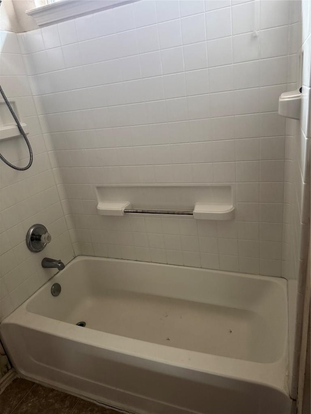 full bathroom with tile patterned flooring and shower / bath combination