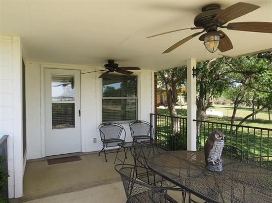 view of patio / terrace featuring outdoor dining area and a ceiling fan