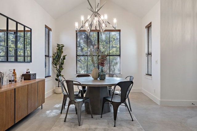 1018 Harwood Pl, Austin, TX 78704 - dining area featuring concrete floors, a chandelier, baseboards, and lofted ceiling