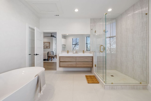 bathroom with vanity, a soaking tub, ensuite bath, a shower stall, and visible vents