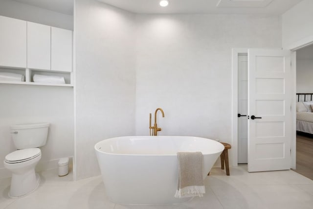 1018 Harwood Pl, Austin, TX 78704 - bathroom with a soaking tub, ensuite bathroom, toilet, tile patterned flooring, and recessed lighting