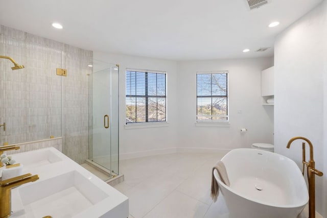 full bath featuring visible vents, a freestanding bath, tile patterned flooring, recessed lighting, and a stall shower