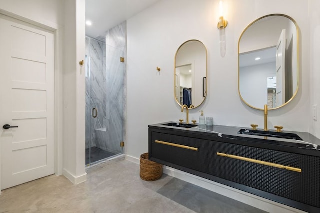1018 Harwood Pl, Austin, TX 78704 - bathroom featuring a marble finish shower, concrete flooring, double vanity, recessed lighting, and baseboards