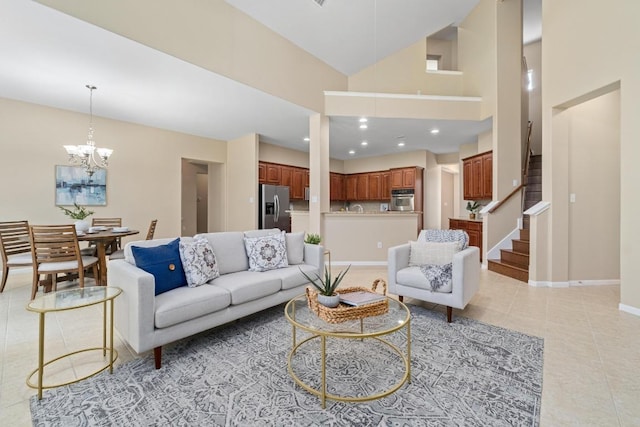 living room featuring a notable chandelier, baseboards, recessed lighting, stairway, and light tile patterned flooring