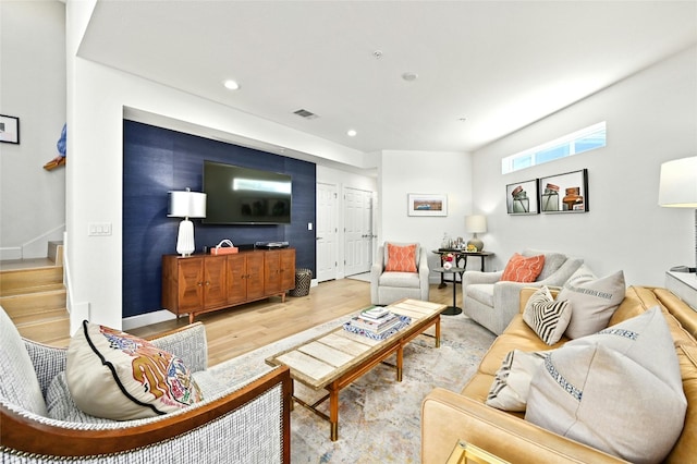 4001 Red River St Unit 2, Austin, TX 78751 - living area featuring visible vents, wood finished floors, stairway, baseboards, and recessed lighting