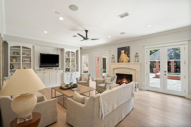 2601 Buckminister Ct, Austin, TX 78746 - living room with french doors, ornamental molding, recessed lighting, light wood-type flooring, and a ceiling fan