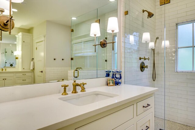 2601 Buckminister Ct, Austin, TX 78746 - full bath with a shower stall, vanity, and plenty of natural light