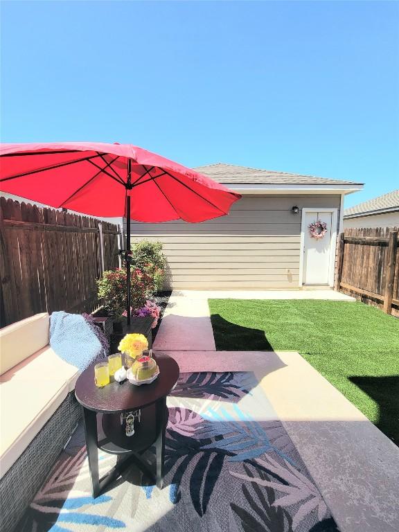 1765 Yaupon Grove Ln, Leander, TX 78641 - fenced backyard featuring a patio area