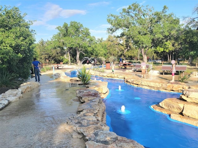 1765 Yaupon Grove Ln, Leander, TX 78641 - view of pool with a swimming pool and view of wooded area
