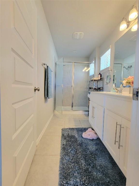 1765 Yaupon Grove Ln, Leander, TX 78641 - full bath with vanity, tile patterned flooring, and a stall shower