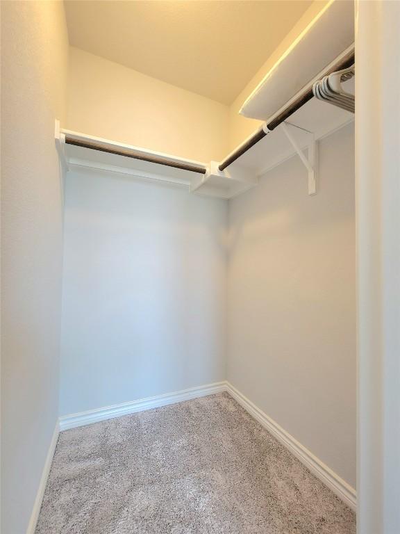 1765 Yaupon Grove Ln, Leander, TX 78641 - walk in closet featuring carpet
