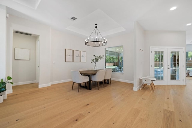 113 Oak Plaza Dr, Georgetown, TX 78628 - dining area featuring french doors, visible vents, light wood-style flooring, and baseboards