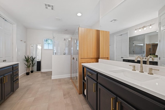 113 Oak Plaza Dr, Georgetown, TX 78628 - full bathroom featuring vanity, a stall shower, baseboards, and recessed lighting