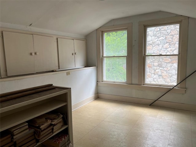 1010 Avondale Rd, Austin, TX 78704 - unfurnished dining area featuring lofted ceiling, baseboards, and light flooring