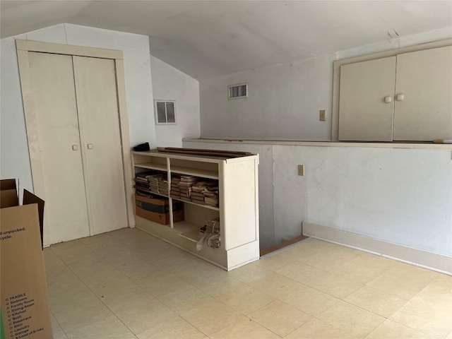 1010 Avondale Rd, Austin, TX 78704 - kitchen featuring lofted ceiling and tile patterned floors