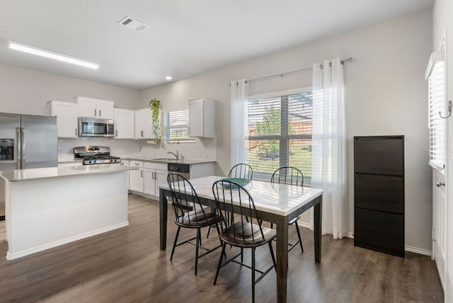 10805 Dimitrios Dr, Austin, TX 78747 - dining space featuring dark wood-type flooring and recessed lighting
