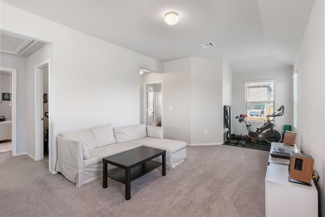 10805 Dimitrios Dr, Austin, TX 78747 - carpeted living room featuring attic access and vaulted ceiling