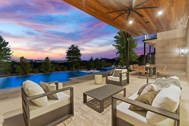 4816 Pecan Chase, Austin, TX 78738 - pool at dusk featuring outdoor lounge area, a patio, outdoor dining area, and a ceiling fan