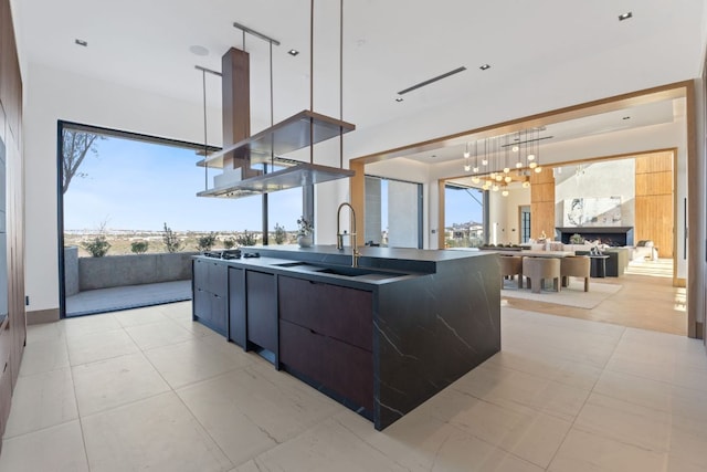 4816 Pecan Chase, Austin, TX 78738 - kitchen featuring modern cabinets, healthy amount of natural light, a sink, and open floor plan