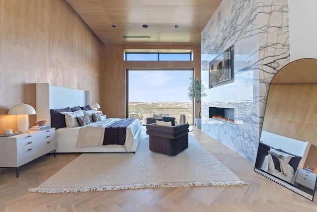 4816 Pecan Chase, Austin, TX 78738 - bedroom featuring a high ceiling and a fireplace