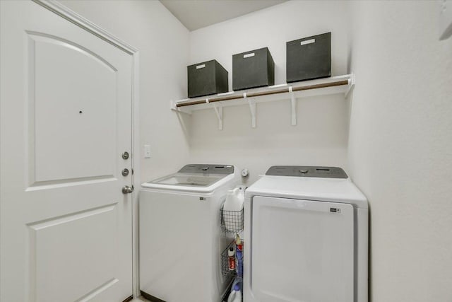 clothes washing area with laundry area and washer and clothes dryer
