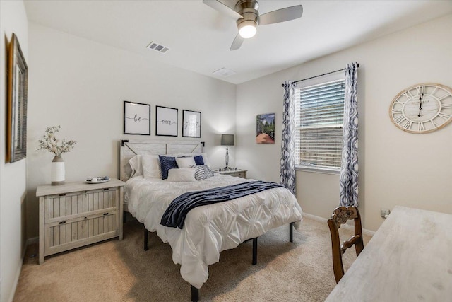 bedroom with visible vents, baseboards, ceiling fan, and light carpet