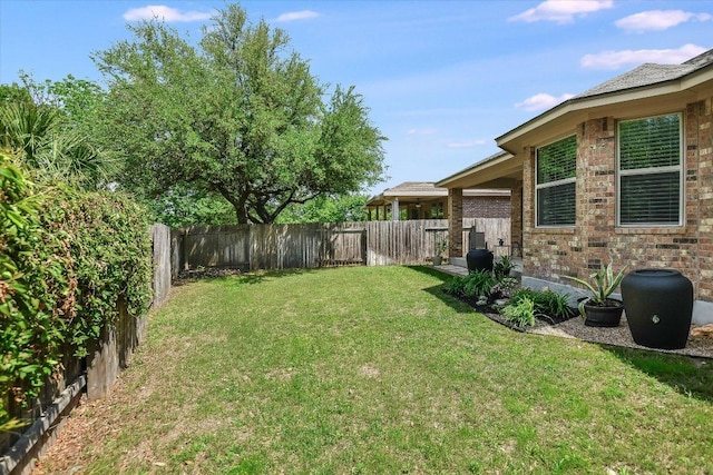view of yard featuring a fenced backyard