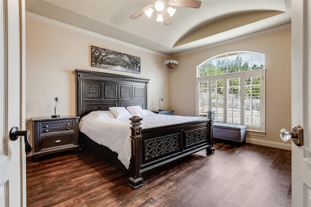 bedroom featuring baseboards, dark wood finished floors, crown molding, and vaulted ceiling