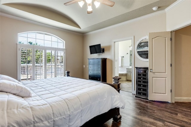 bedroom with baseboards, ornamental molding, dark wood finished floors, connected bathroom, and vaulted ceiling
