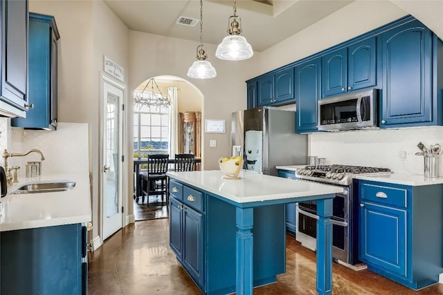 kitchen featuring finished concrete flooring, blue cabinets, appliances with stainless steel finishes, and a sink