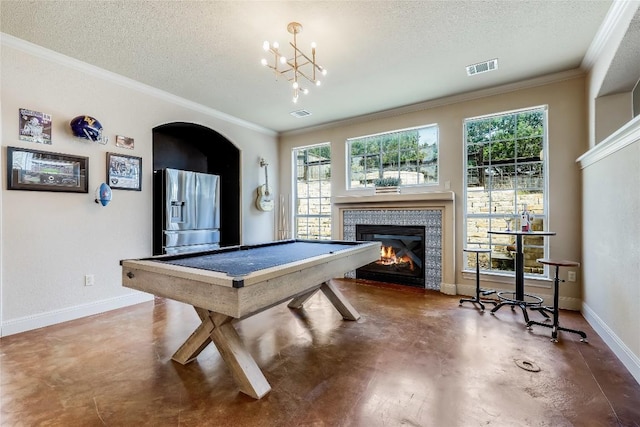 recreation room featuring concrete floors, crown molding, visible vents, and a textured ceiling