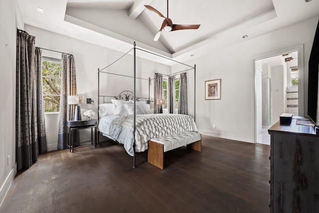 bedroom featuring baseboards, multiple windows, and hardwood / wood-style floors