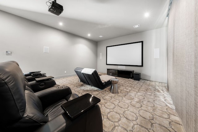 home theater room featuring recessed lighting, stone finish floor, and visible vents