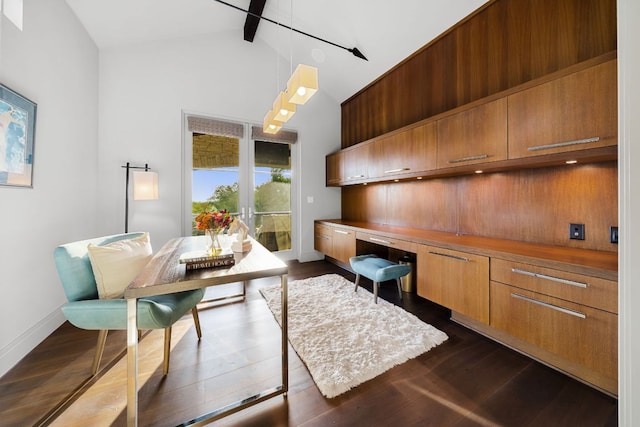 office with baseboards, dark wood-style flooring, beam ceiling, and built in desk