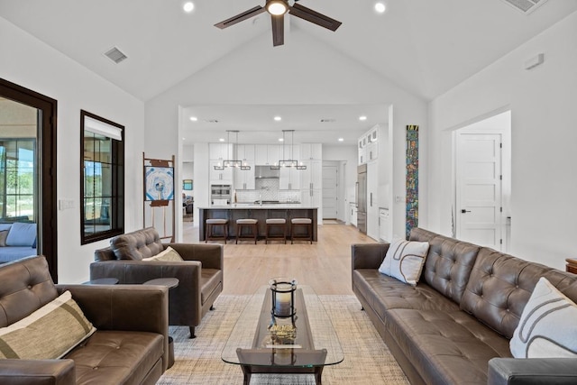4010 County Road 404, Spicewood, TX 78669 - living room featuring a ceiling fan, light wood-style floors, recessed lighting, and high vaulted ceiling