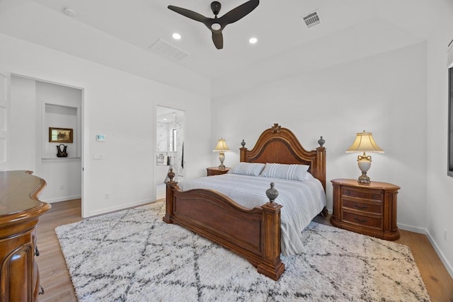 4010 County Road 404, Spicewood, TX 78669 - bedroom with wood finished floors, baseboards, recessed lighting, ensuite bath, and a ceiling fan
