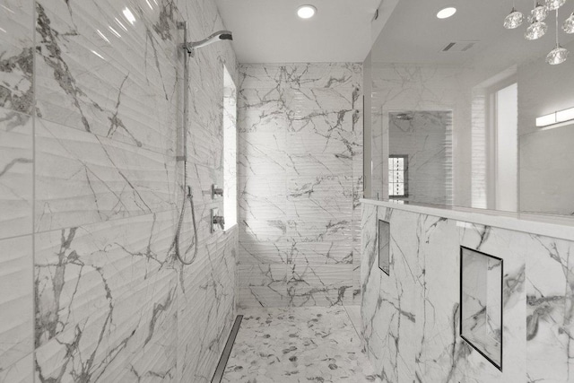 4010 County Road 404, Spicewood, TX 78669 - bathroom with a marble finish shower and recessed lighting