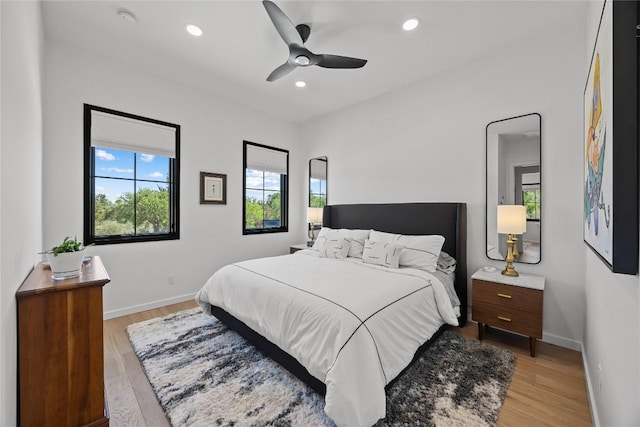 4010 County Road 404, Spicewood, TX 78669 - bedroom with multiple windows, light wood-type flooring, baseboards, and recessed lighting