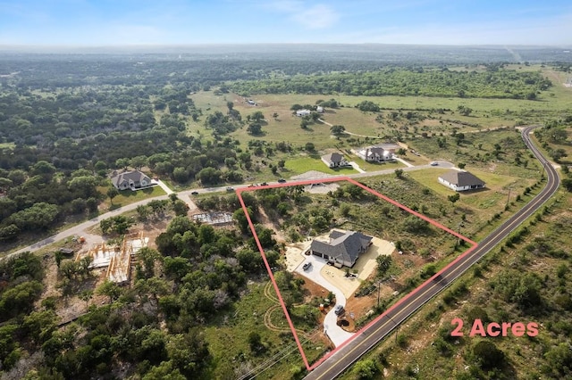 4010 County Road 404, Spicewood, TX 78669 - aerial view of property and surrounding area with property boundaries highlighted and a forest